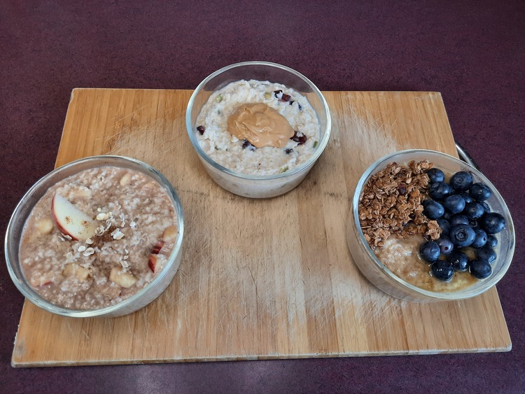 The three Oatmeal Bowls After Cooking and putting on the toppings. Apple Cinnamon Pie, Cranberry and Protein, and Blueberry Crumble.