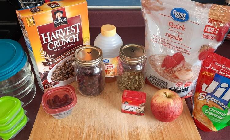 A countertop with a cutting board and many ingredients. Oatmeal Bowl Ingredients