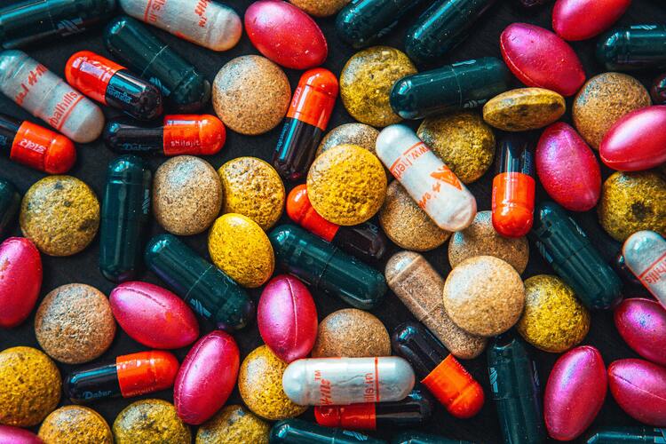 Picture of colorful supplements mixed up in a pile. Weight Loss Pills