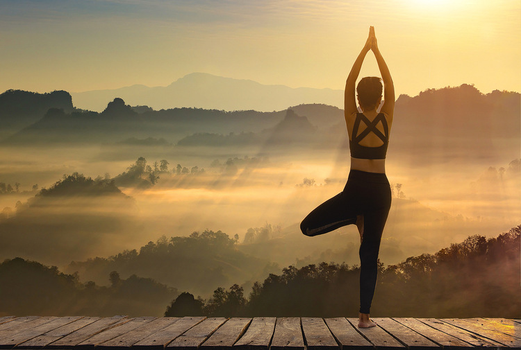 Young girl doing yoga fitness exercise outdoor in beautiful mountains and morning sunrise. pose vital and meditation for fitness lifestyle. Mental Benefits of Exercise